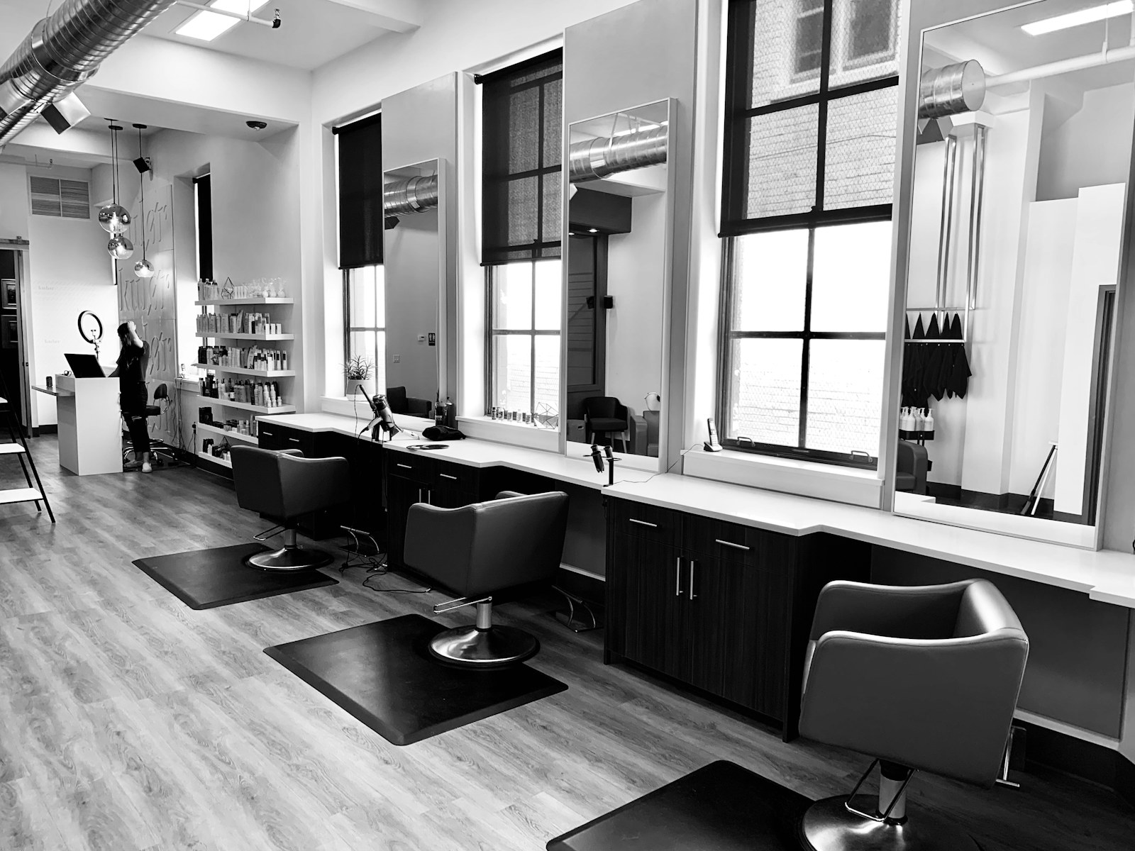Professional hair salon with mirrors and styling chairs