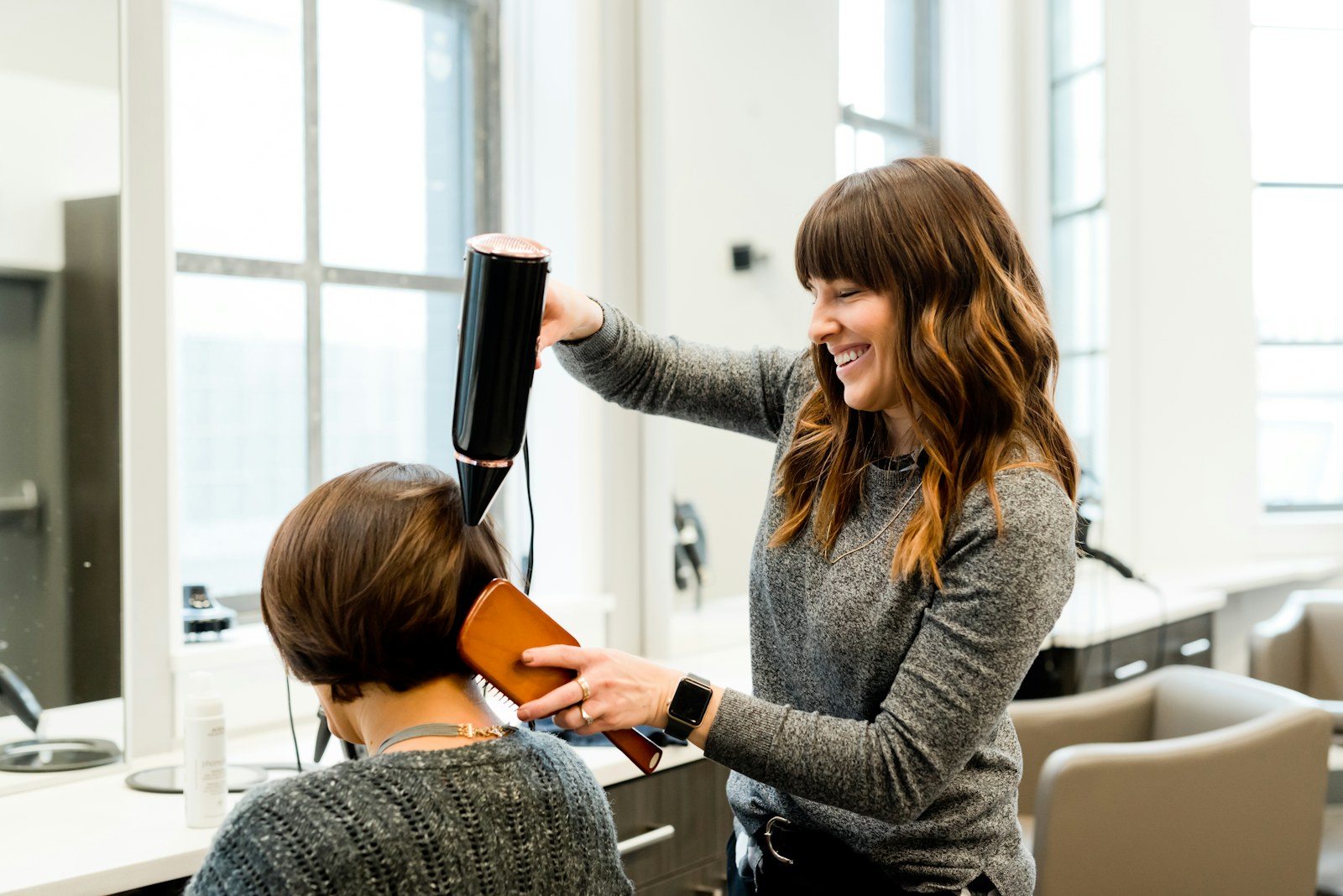 Hair being styled in a salon